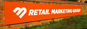 Retail Marketing Group company sign by Bluedot Display Ltd