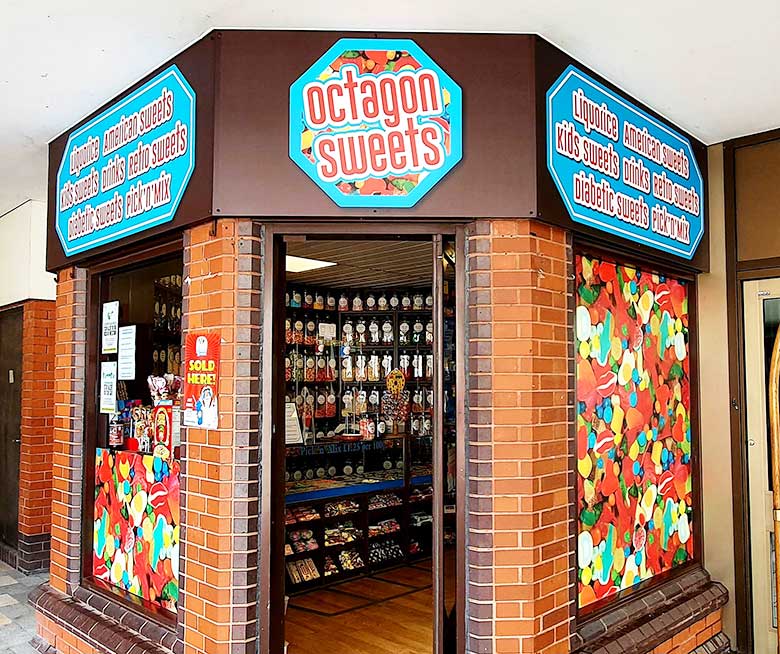 Dibond aluminium shop signage and widow graphics by Bluedot for Octagon Sweets