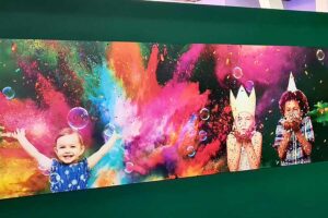 Children at play vinyl wall graphics printed for Kidspace Romford by Bluedot Display
