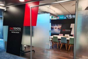 Large vinyl window graphics with Toyota branding created for a meeting room at the Toyota GB offices in Epsom by Bluedot Display