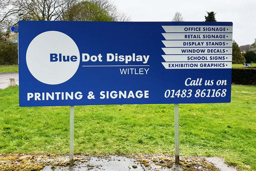 Large Dibond aluminium sign with Bluedot Display branding outside Surrey Sports Park in Guildford