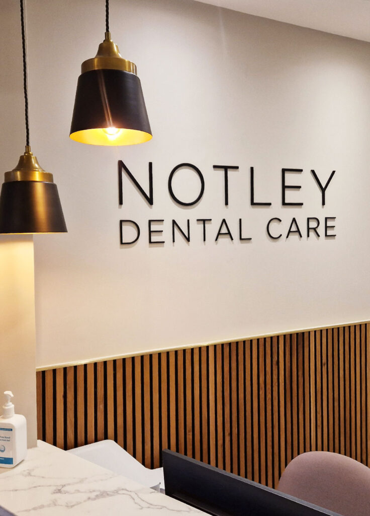 Stand off individual lettering business reception sign created by Bluedot Display for Notley Dental Care clinic