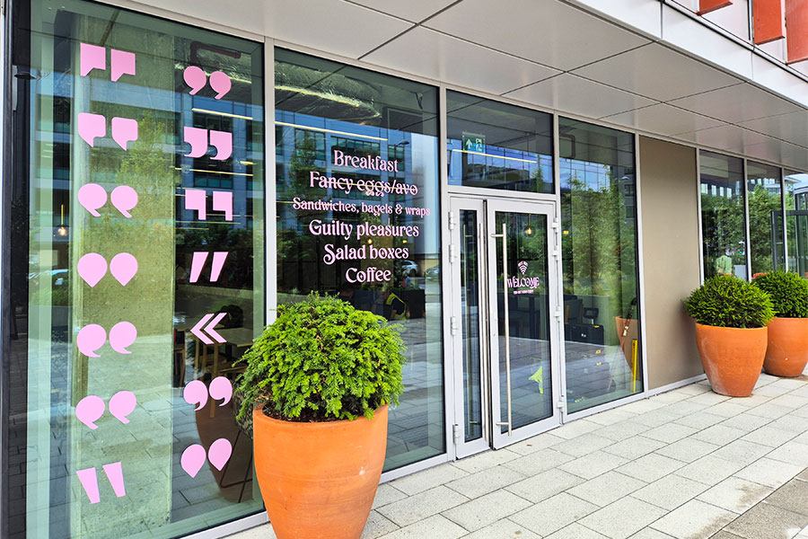 Prominent bright pink window graphics created for a coffee shop in Surrey by Bluedot Display 