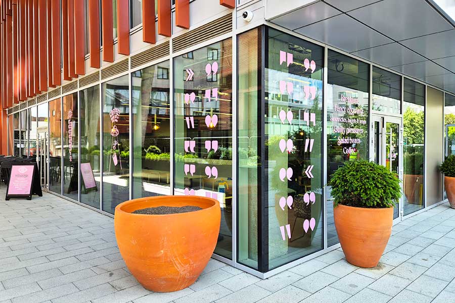 Pink cut vinyl window decals installed at Bla Bla Cafe in Watford by Bluedot Display