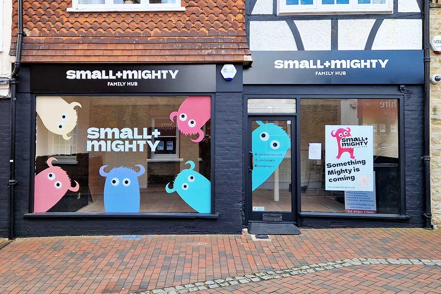 Bright and colourful vinyl window graphics by Bluedot Display for Small and Mighty in Godalming