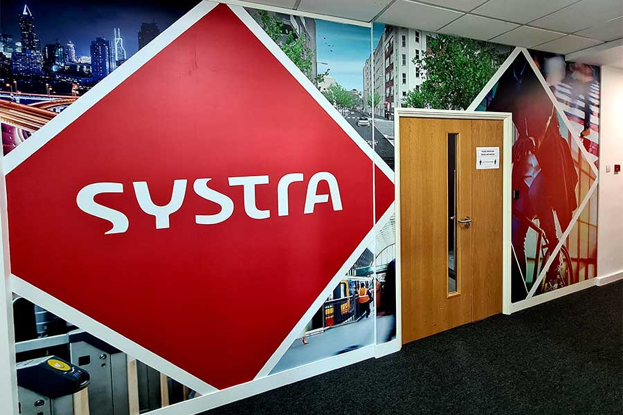 Large format vinyl full wall wraps printed and installed at the offices of Systra in Woking by Bluedot Display Ltd