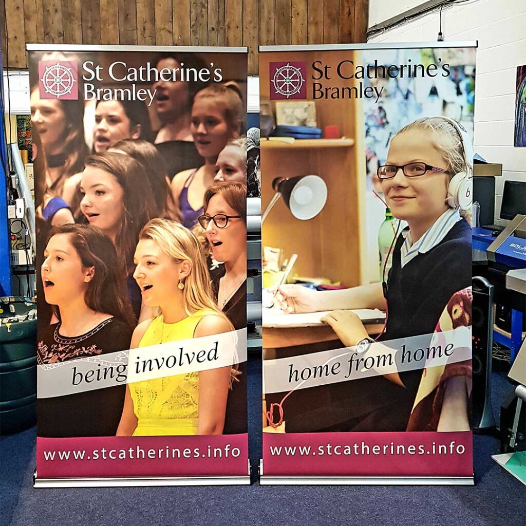 Roller banner graphics showing students printed for St. Catherine's School in Bramley by Bluedot Display