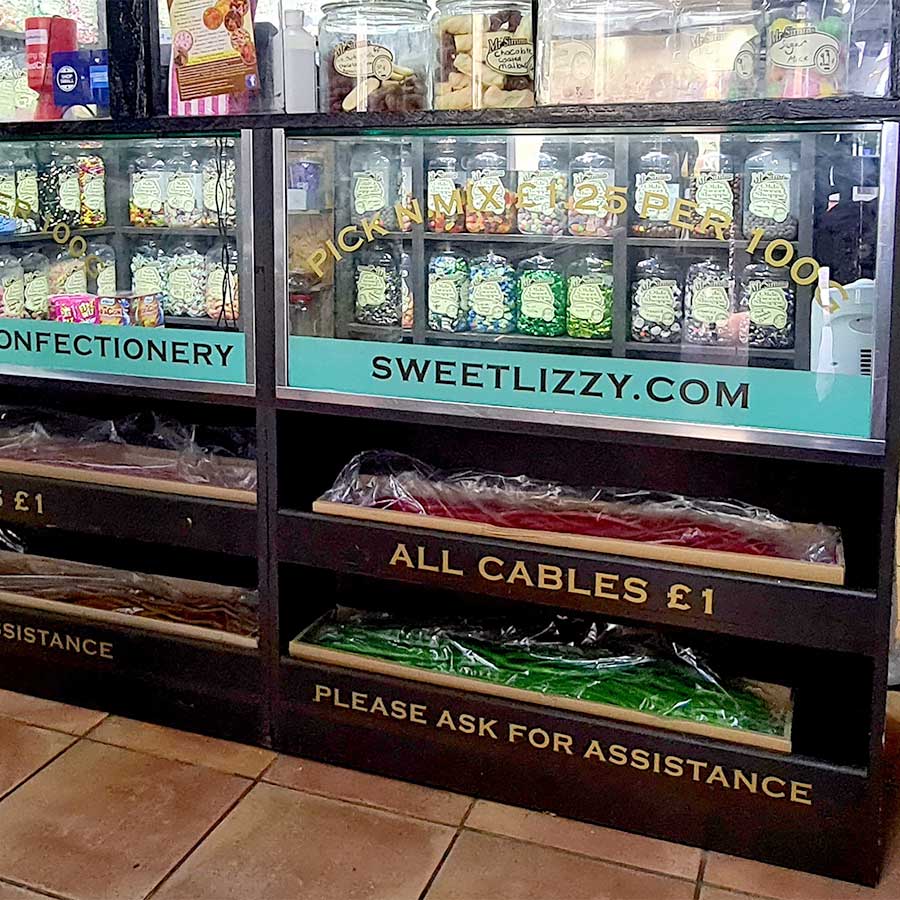Window graphics printed and installed at Sweet Lizzy sweet shop in Farnham town centre by Bluedot Display