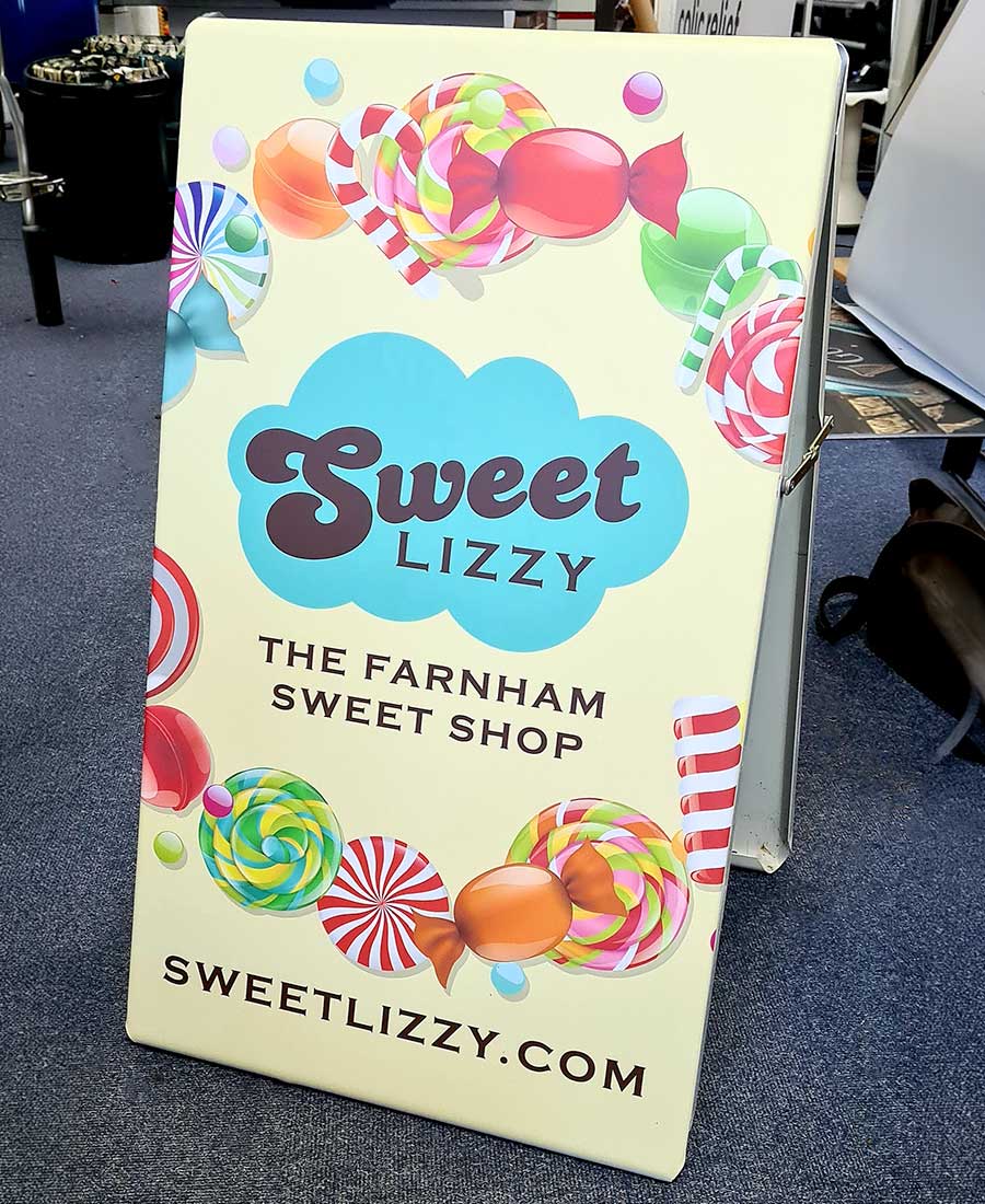 Colorful pavement advertising sign created for the Farnham Sweet Shop by Bluedot Display